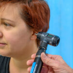 A patient's ear being examined