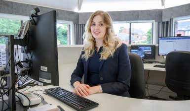 A receptionist at their desk