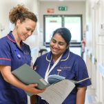 Nurses discussing patient notes