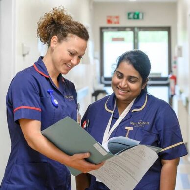 Nurses reading patient file