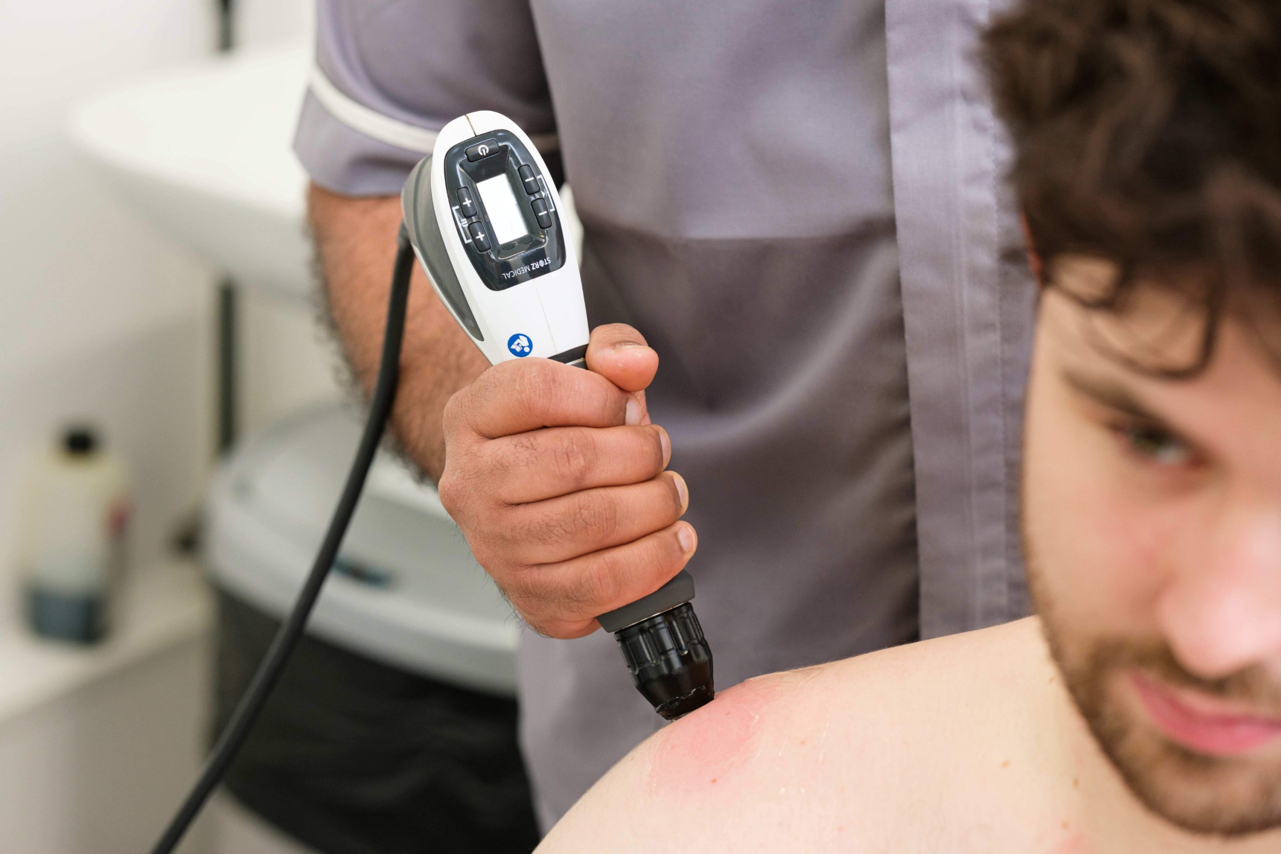Physiotherapy shockwave therapy on shoulder